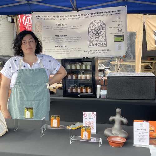 Carmen Roberts from Cancha Mojo standing on market stall