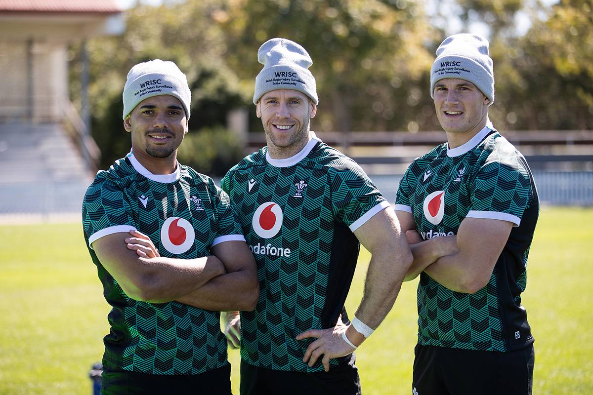 3 rugby players wearing hats