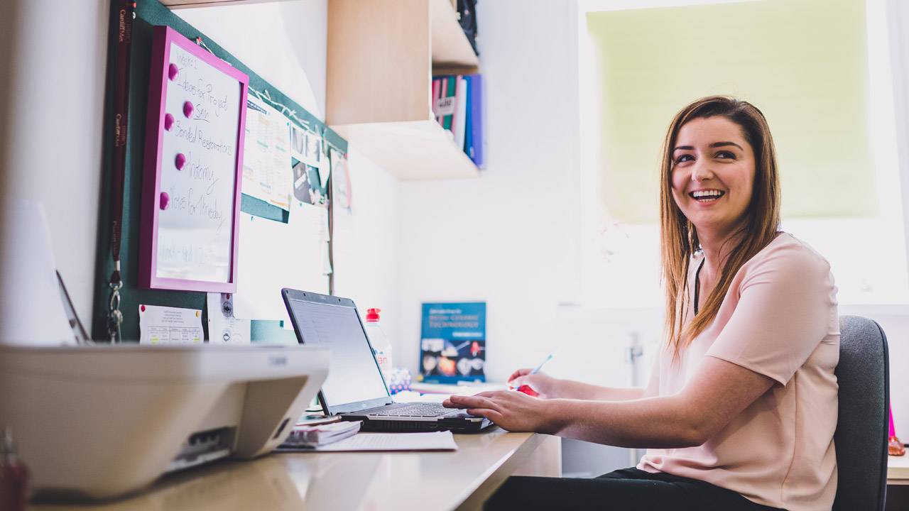 Student at desk in accommodation