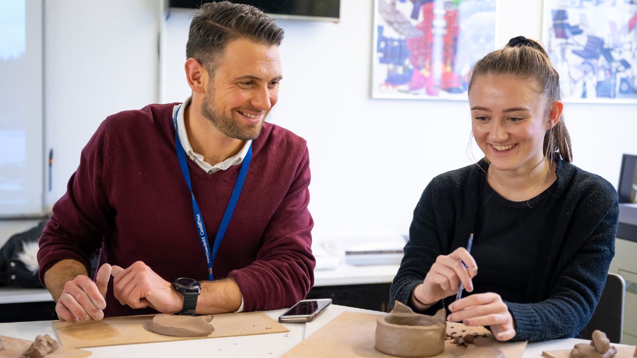 Student working with clay